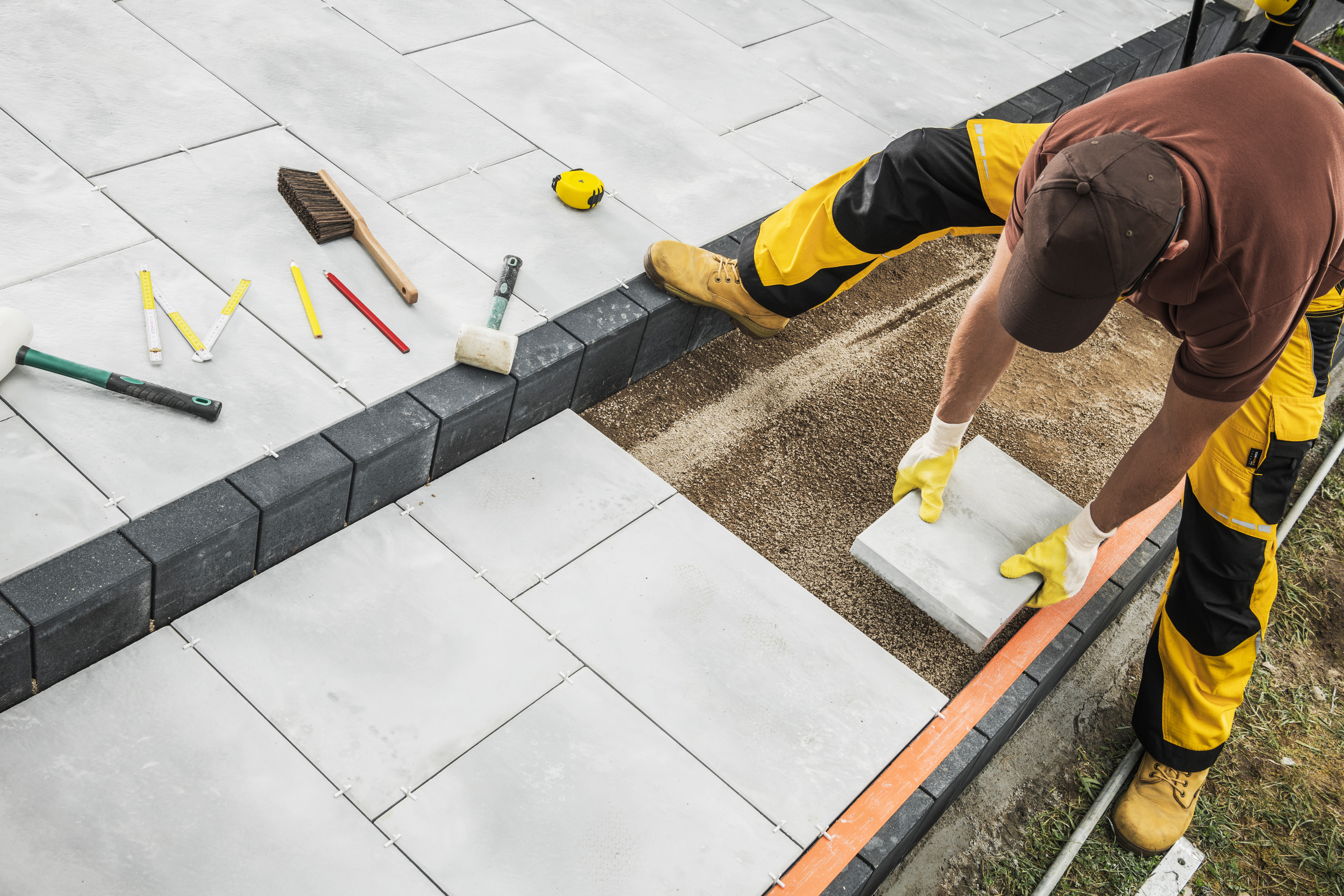 Hardscaping project with stonework and structural landscape features in Orange County